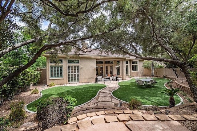801 Aquitaine Ct, Las Vegas, NV 89145 - rear view of house with stucco siding, a fenced backyard, and a patio