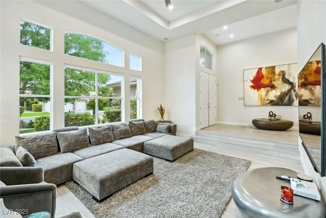 801 Aquitaine Ct, Las Vegas, NV 89145 - living area featuring wood finished floors, a towering ceiling, recessed lighting, and a raised ceiling
