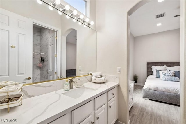 801 Aquitaine Ct, Las Vegas, NV 89145 - bathroom featuring vanity, wood finished floors, and ensuite bath