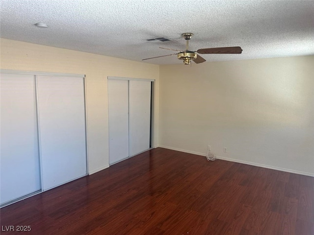 4356 Sabadell St, Las Vegas, NV 89121 - unfurnished bedroom featuring multiple closets, wood finished floors, baseboards, a ceiling fan, and a textured ceiling