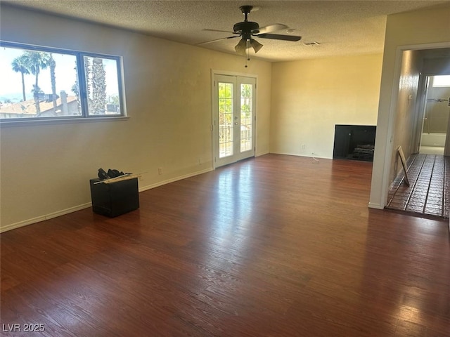 4356 Sabadell St, Las Vegas, NV 89121 - unfurnished room featuring dark wood finished floors, a ceiling fan, a textured ceiling, and baseboards