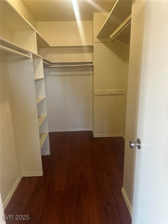 4356 Sabadell St, Las Vegas, NV 89121 - spacious closet featuring dark wood-style flooring