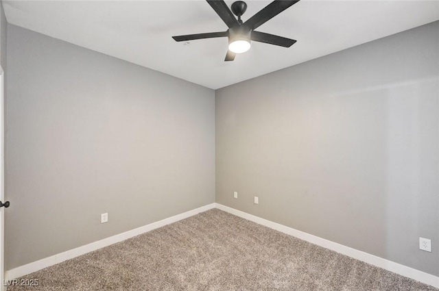 spare room with ceiling fan, carpet floors, and baseboards