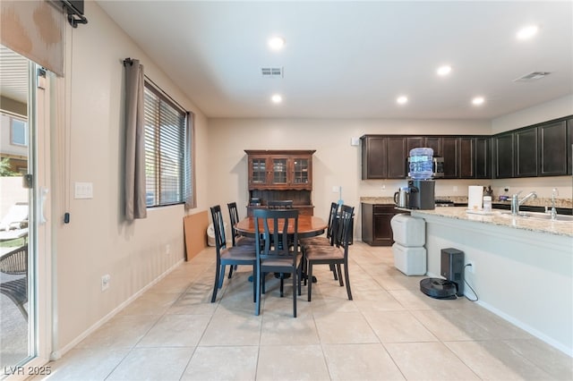 4524 Stardusk Falls Ave, North Las Vegas, NV 89084 - dining room with recessed lighting and light tile patterned floors