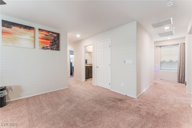 4524 Stardusk Falls Ave, North Las Vegas, NV 89084 - corridor featuring light colored carpet, baseboards, recessed lighting, and an upstairs landing