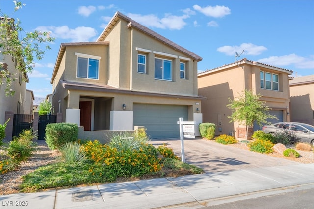 4524 Stardusk Falls Ave, North Las Vegas, NV 89084 - view of property with a garage, stucco siding, and concrete driveway