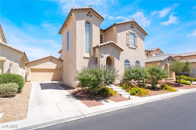 5854 Willow Trace Ave, Las Vegas, NV 89139 - mediterranean / spanish house with a tile roof, stucco siding, a garage, and driveway