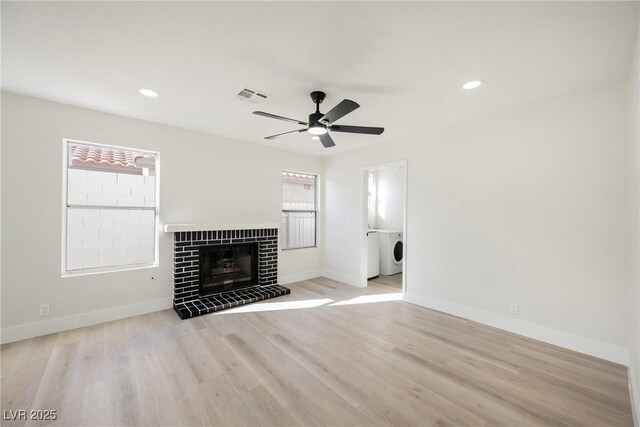 4669 Winfield Dr, Las Vegas, NV 89147 - unfurnished living room featuring a ceiling fan, baseboards, light wood-style flooring, recessed lighting, and a tiled fireplace