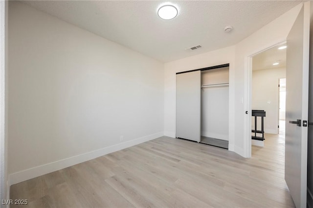 4669 Winfield Dr, Las Vegas, NV 89147 - unfurnished bedroom with light wood-type flooring, a closet, and baseboards