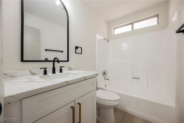 4669 Winfield Dr, Las Vegas, NV 89147 - full bath with toilet, wood finished floors, vanity, and tub / shower combination