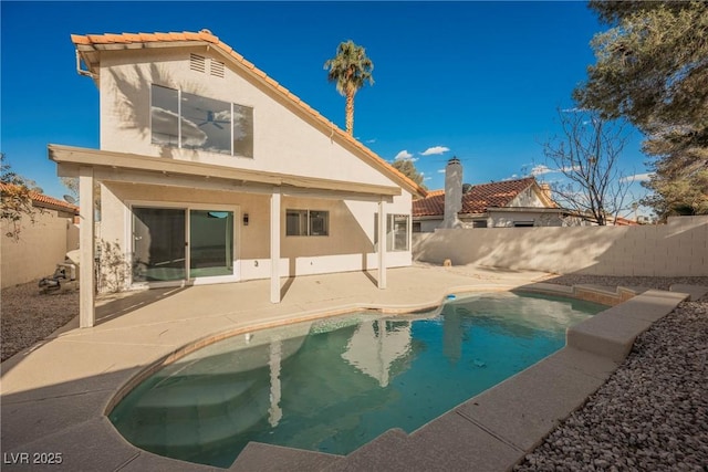 4669 Winfield Dr, Las Vegas, NV 89147 - rear view of house with stucco siding, a fenced backyard, and a patio area