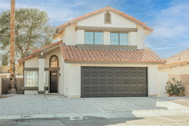 4669 Winfield Dr, Las Vegas, NV 89147 - mediterranean / spanish-style house with stucco siding, a tile roof, a garage, and driveway