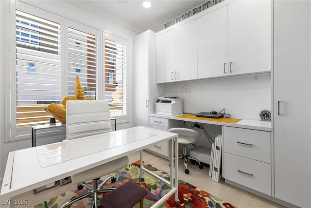 office with ornamental molding, built in study area, and radiator heating unit
