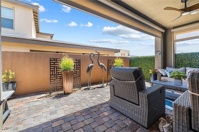 view of patio with a ceiling fan and an outdoor hangout area