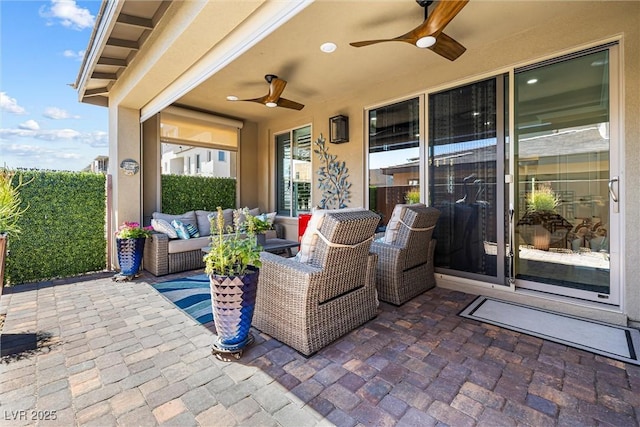 view of patio featuring a ceiling fan and outdoor lounge area