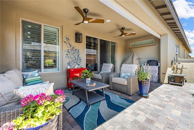 view of patio with an outdoor hangout area and a ceiling fan