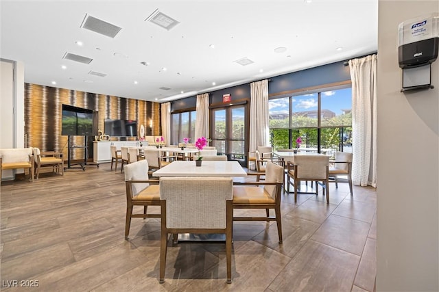 dining area featuring recessed lighting and wood finished floors