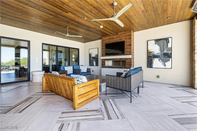 view of patio with ceiling fan and an outdoor living space