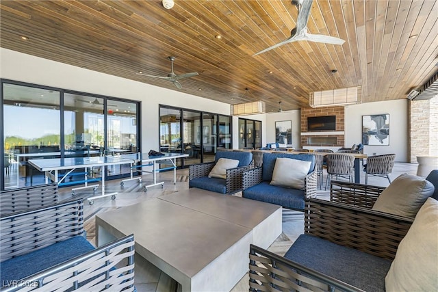 view of patio with an outdoor hangout area and ceiling fan