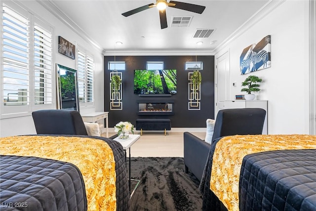 bedroom with ornamental molding, multiple windows, wood finished floors, recessed lighting, and a ceiling fan