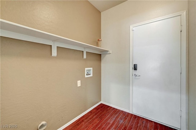 washroom featuring dark wood finished floors, washer hookup, and baseboards
