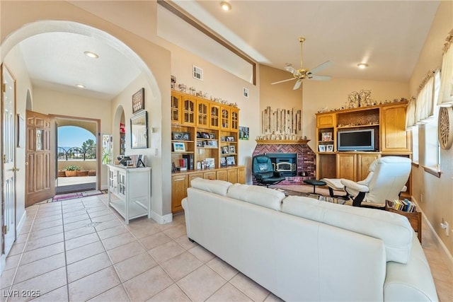 3640 E Vineyard Dr, Pahrump, NV 89048 - living room featuring arched walkways, a ceiling fan, light tile patterned floors, baseboards, and recessed lighting