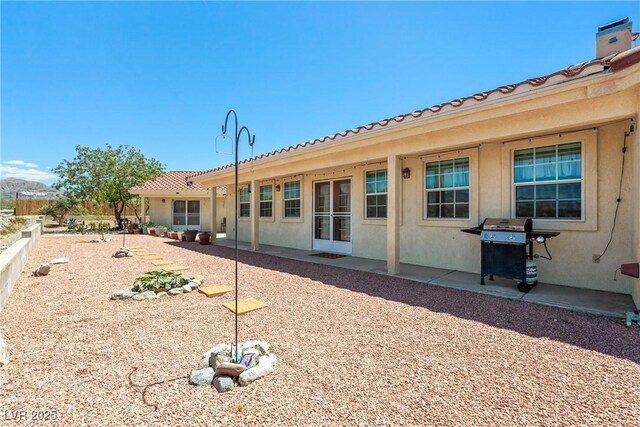 3640 E Vineyard Dr, Pahrump, NV 89048 - rear view of property featuring stucco siding and a patio