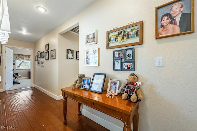 3640 E Vineyard Dr, Pahrump, NV 89048 - hallway with baseboards, wood-type flooring, and recessed lighting