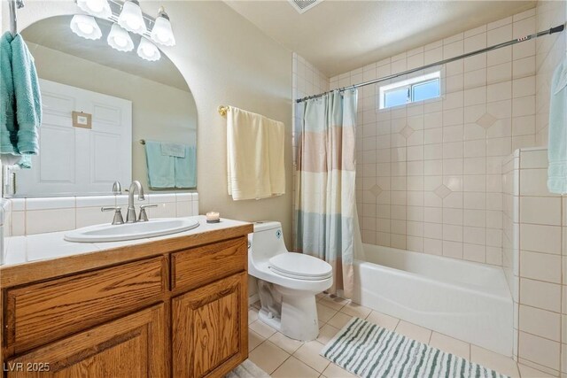 3640 E Vineyard Dr, Pahrump, NV 89048 - full bath featuring tile patterned floors, toilet, shower / tub combo, and vanity