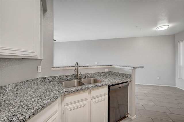 7189 S Durango Dr Unit 208, Las Vegas, NV 89113 - kitchen with dishwashing machine, a sink, a peninsula, white cabinets, and light stone countertops