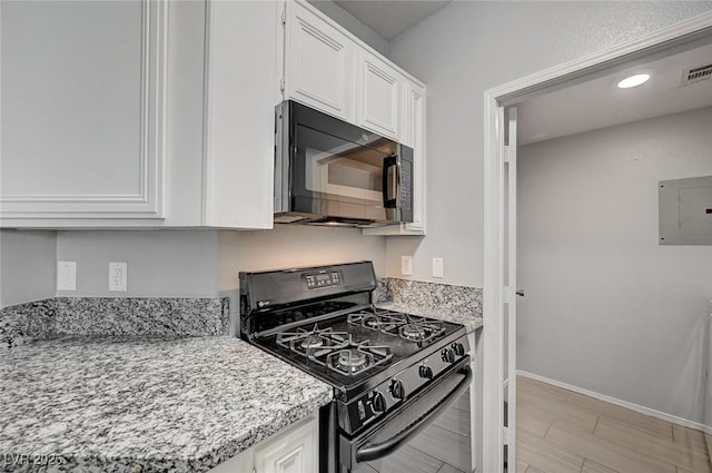 7189 S Durango Dr Unit 208, Las Vegas, NV 89113 - kitchen with black appliances, electric panel, white cabinets, baseboards, and light stone countertops