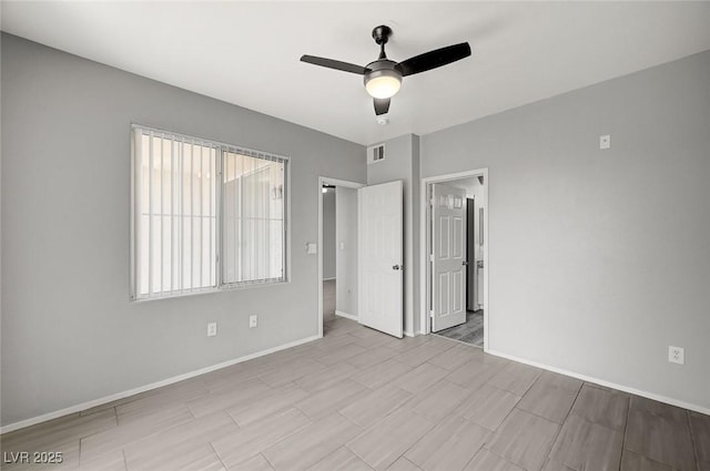 7189 S Durango Dr Unit 208, Las Vegas, NV 89113 - unfurnished room featuring baseboards and a ceiling fan