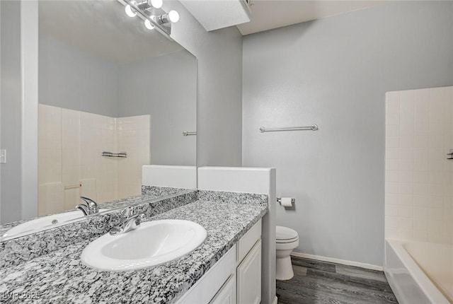 7189 S Durango Dr Unit 208, Las Vegas, NV 89113 - bathroom with toilet, vanity, wood finished floors, and baseboards
