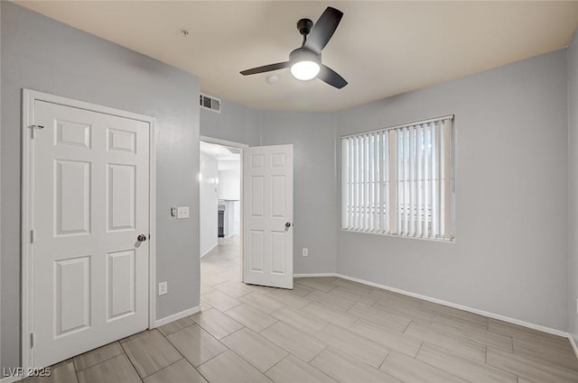 7189 S Durango Dr Unit 208, Las Vegas, NV 89113 - unfurnished bedroom with baseboards and ceiling fan