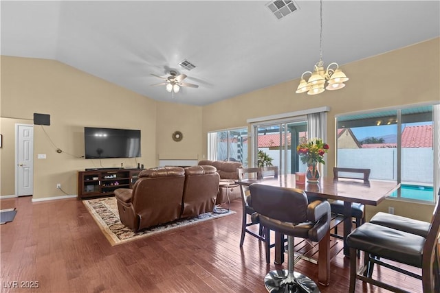 608 Blooming View Ave, North Las Vegas, NV 89032 - living area with vaulted ceiling, wood finished floors, a chandelier, ceiling fan, and baseboards