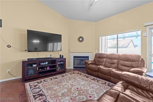 608 Blooming View Ave, North Las Vegas, NV 89032 - living room featuring a tiled fireplace, wood finished floors, and baseboards