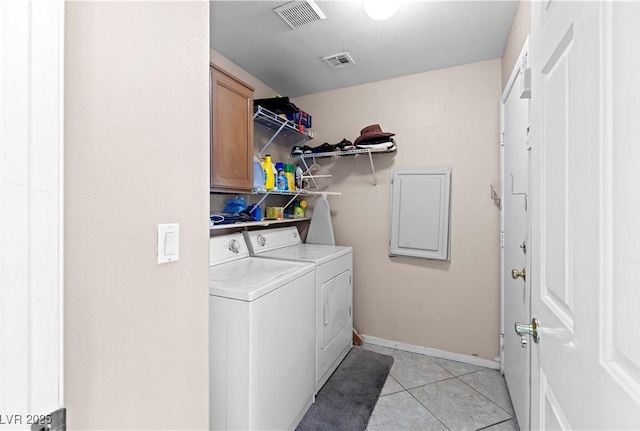 608 Blooming View Ave, North Las Vegas, NV 89032 - laundry room with cabinet space, separate washer and dryer, light tile patterned floors, and baseboards