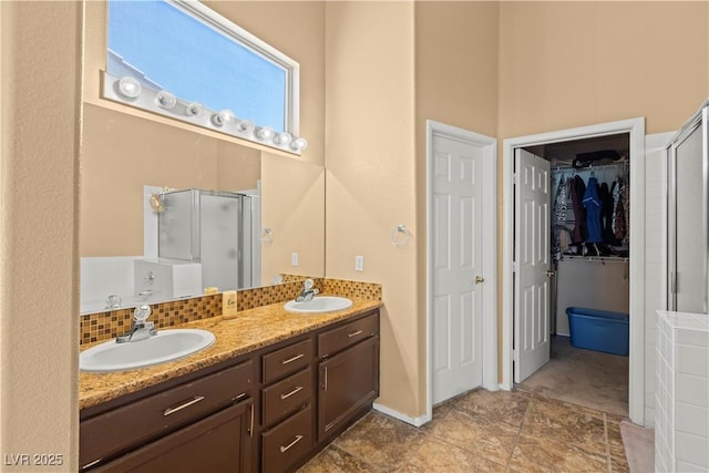 608 Blooming View Ave, North Las Vegas, NV 89032 - full bath featuring a shower stall, double vanity, and a walk in closet