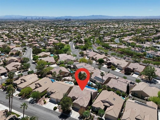 aerial view of residential area with mountains