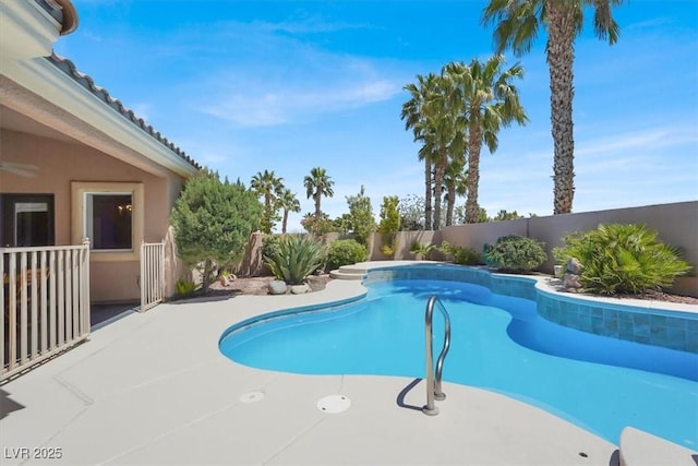 view of swimming pool featuring a fenced backyard