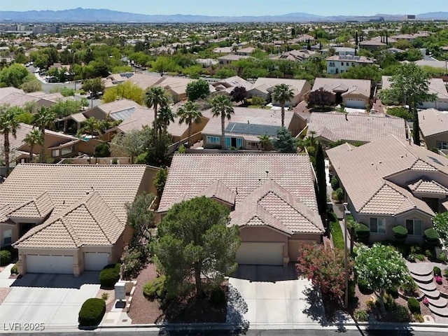 aerial view of residential area featuring a mountain backdrop