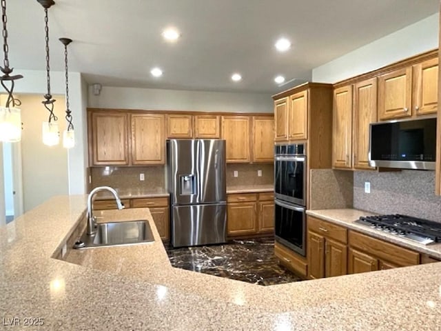 10237 Andante Ct, Las Vegas, NV 89135 - kitchen featuring appliances with stainless steel finishes, a sink, recessed lighting, brown cabinets, and decorative backsplash