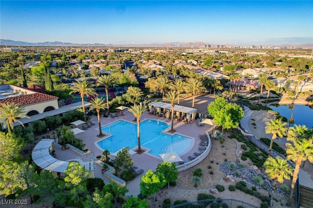 10237 Andante Ct, Las Vegas, NV 89135 - aerial view of residential area featuring a pool and a mountainous background