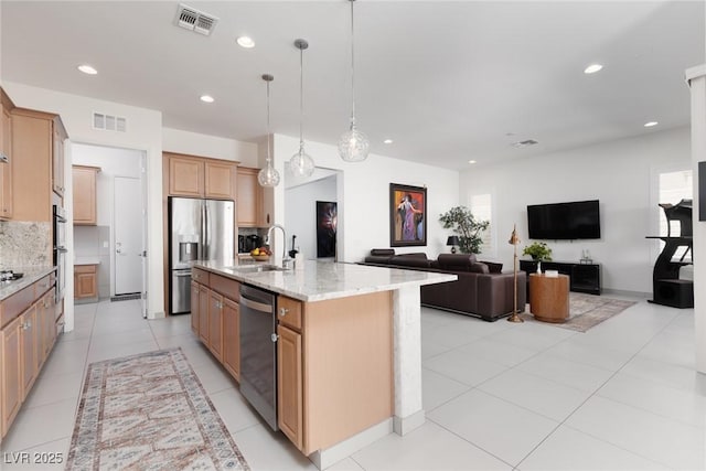 12844 New Providence St, Las Vegas, NV 89141 - kitchen featuring stainless steel appliances, a sink, recessed lighting, backsplash, and light stone countertops