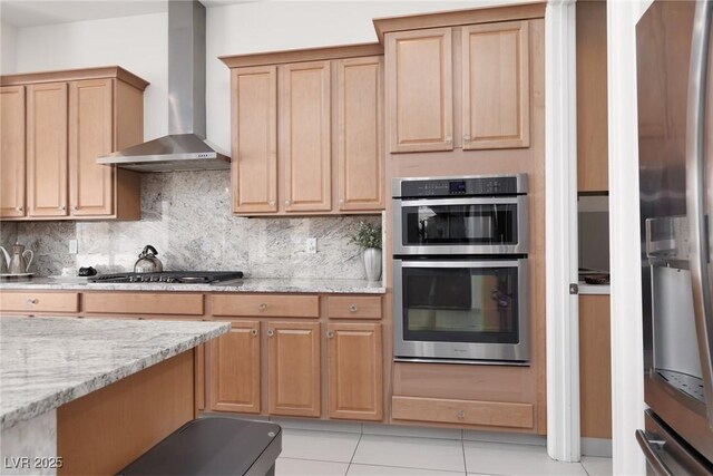 12844 New Providence St, Las Vegas, NV 89141 - kitchen with wall chimney exhaust hood, appliances with stainless steel finishes, tasteful backsplash, light stone countertops, and light tile patterned floors