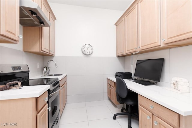 12844 New Providence St, Las Vegas, NV 89141 - office featuring a sink, built in desk, light tile patterned flooring, wainscoting, and tile walls