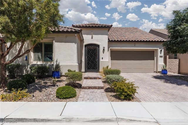 12844 New Providence St, Las Vegas, NV 89141 - mediterranean / spanish-style house featuring a tiled roof, a garage, stucco siding, and driveway