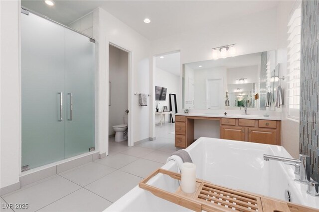 12844 New Providence St, Las Vegas, NV 89141 - full bathroom with a shower stall, vanity, toilet, a soaking tub, and tile patterned flooring