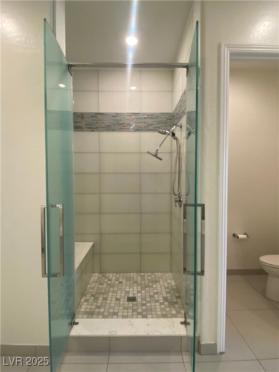 12844 New Providence St, Las Vegas, NV 89141 - full bath with a stall shower, tile patterned floors, toilet, and baseboards