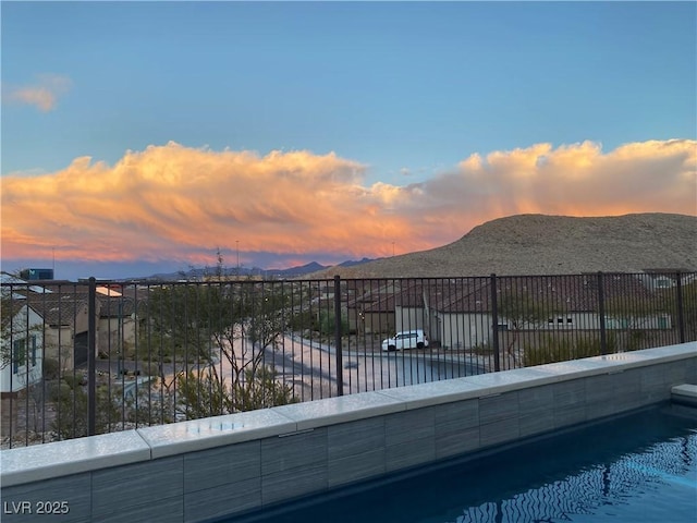 12844 New Providence St, Las Vegas, NV 89141 - pool at dusk featuring a mountain view